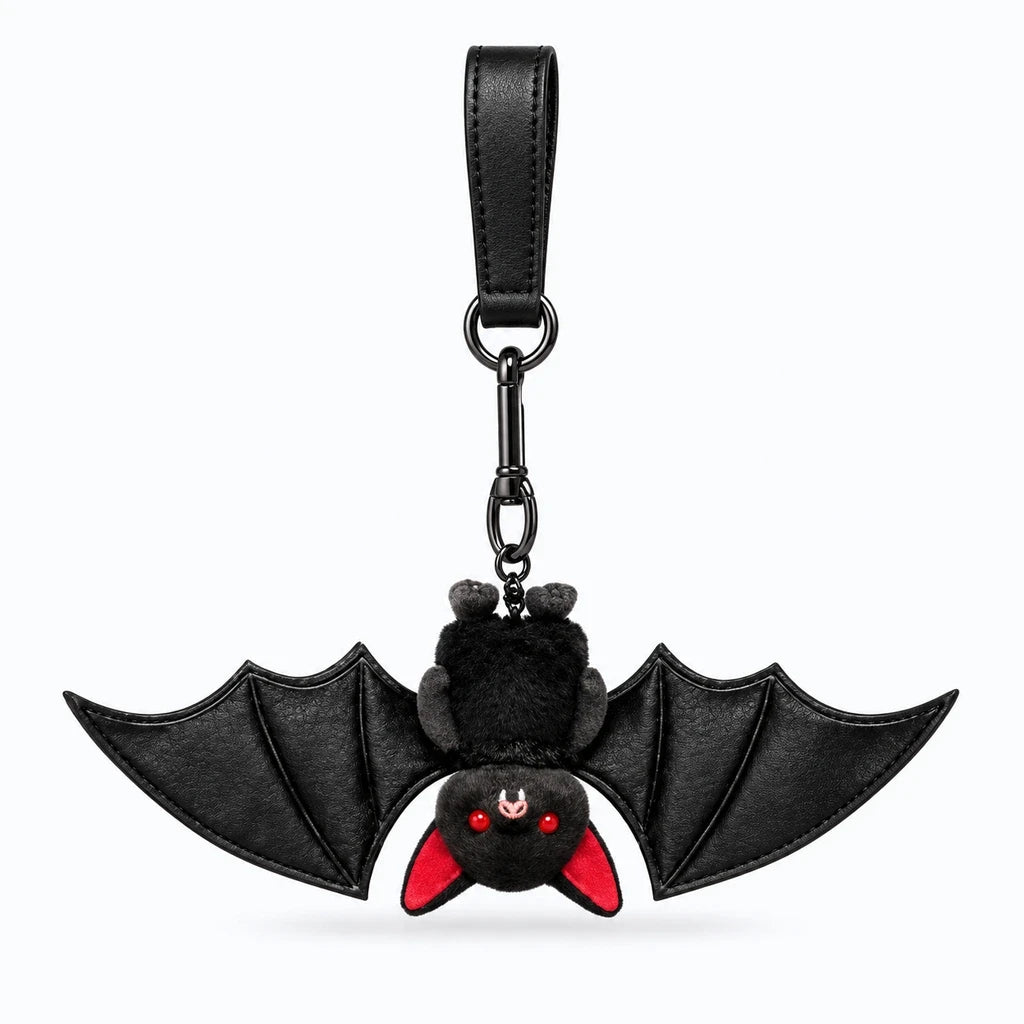 Porte clés doudou rond et doux au toucher, silhouette noire