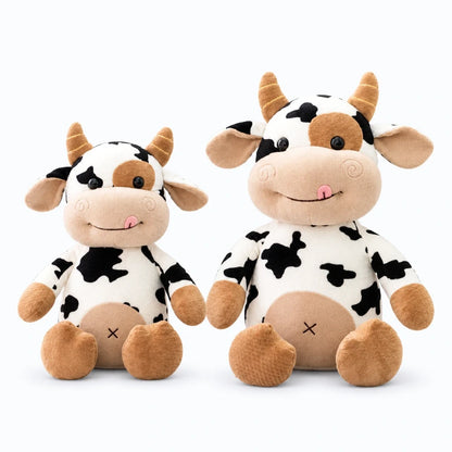 Peluche vache de profil, vêtement tricoté et accessoires miniatures