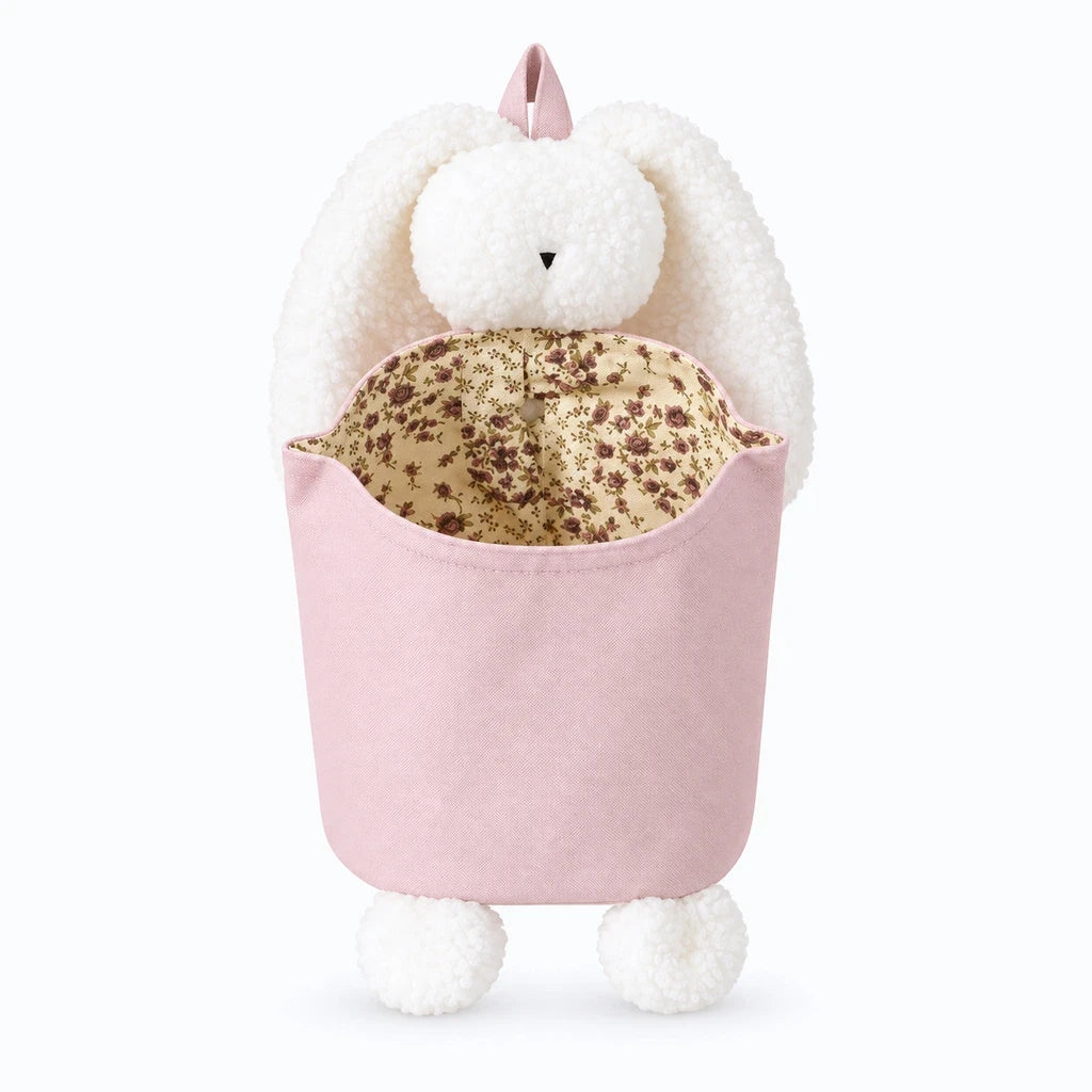 Rangement doudou avec silhouette de lapin douce, fixé près du berceau pour ranger accessoires et petits objets
